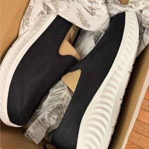 Skechers Women’s Black and White Slip-On Sneakers